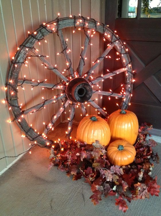 Wagon Wheel Is Decorated With Lights