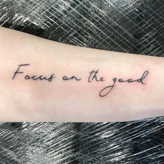 Dynamic Script Tattoo On Arm