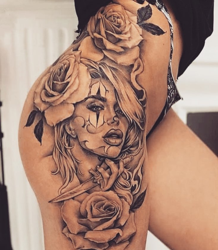 Face Tattoo On Hip With Rose