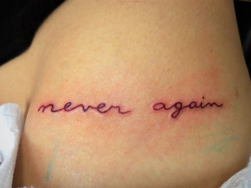 Small Red Lettering Tattoo Done On A Hip