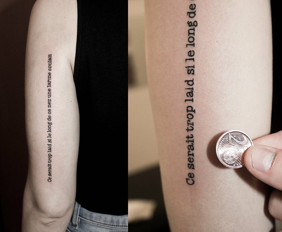Type Writer Small lettering Quote Tattoo On Back Sleeve