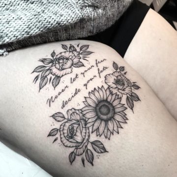 Wild Flowers With Quote Inked On Thigh