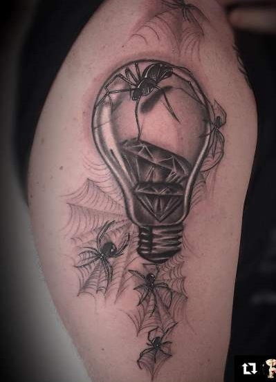 A Light Bulb with Diamonds in it and Spiders Crawling Out