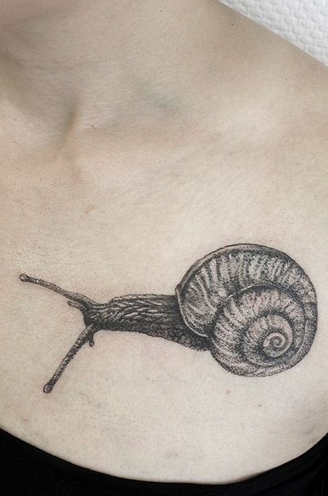 A Small Snail Inked On Collar Bone