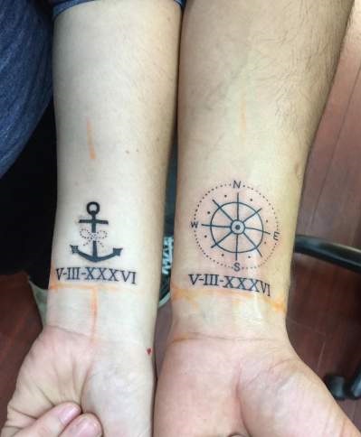 Attractive Traveller Couple Wrist Tattoo