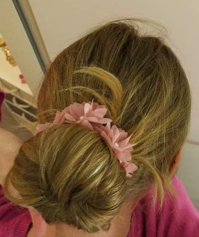 Beautiful Pink Flowers Enhance The Top Knot