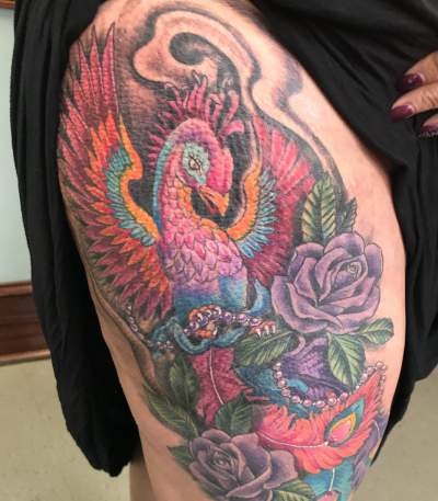Creative Peacock Tattoo With Flowers On Thigh