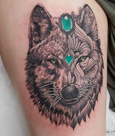 Girl With Artistic Wolf Tattoo On Thigh