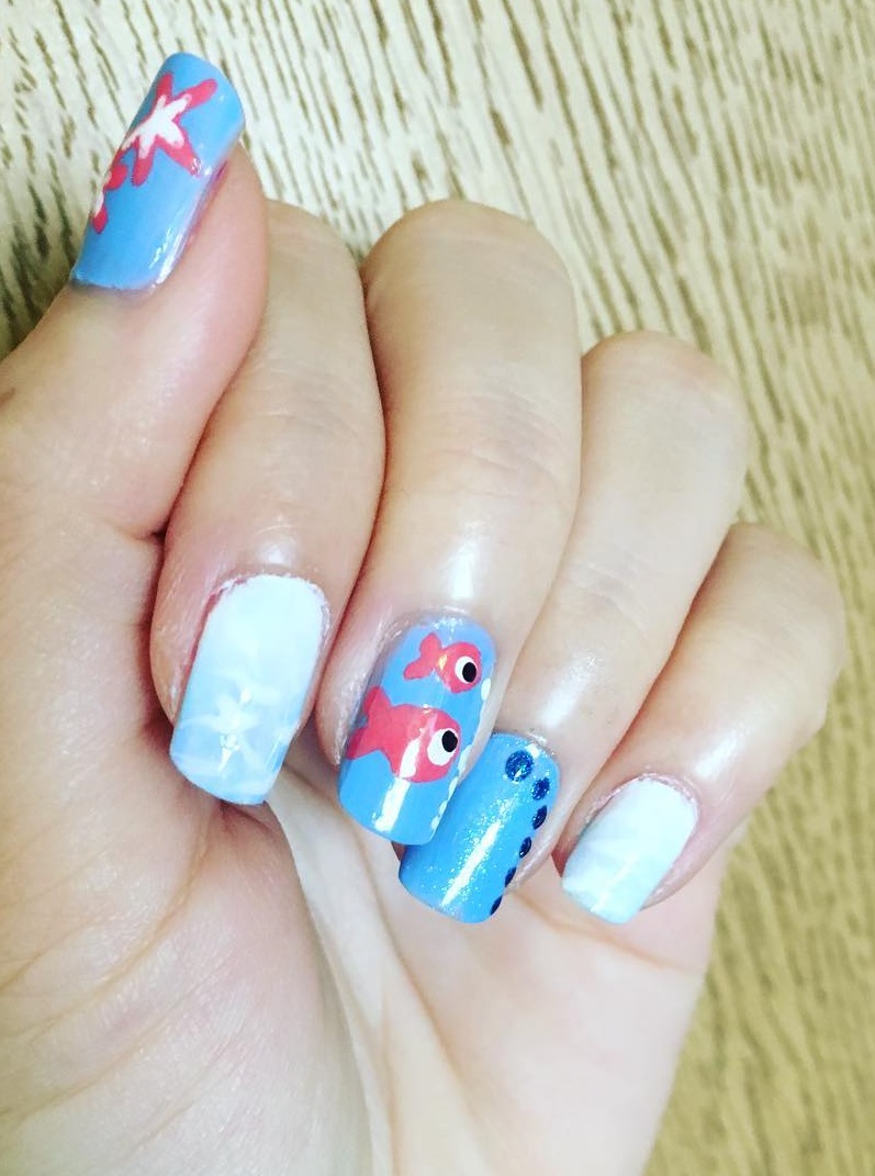 Gorgeous Sky Blue Beach Nails With Fish