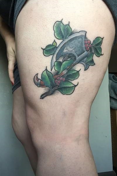 Great Tattoo Work On Thigh With Axe And Leaves