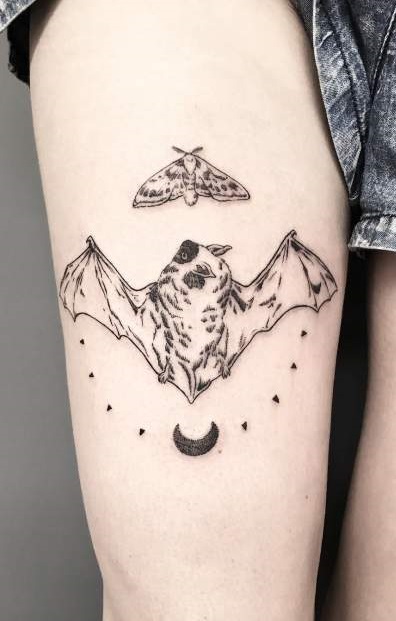 Illustrative Bat Tattoo With Butterfly Tattoo On Thigh