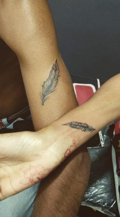 Incredible Feather Tattoo On Wrist For Couple