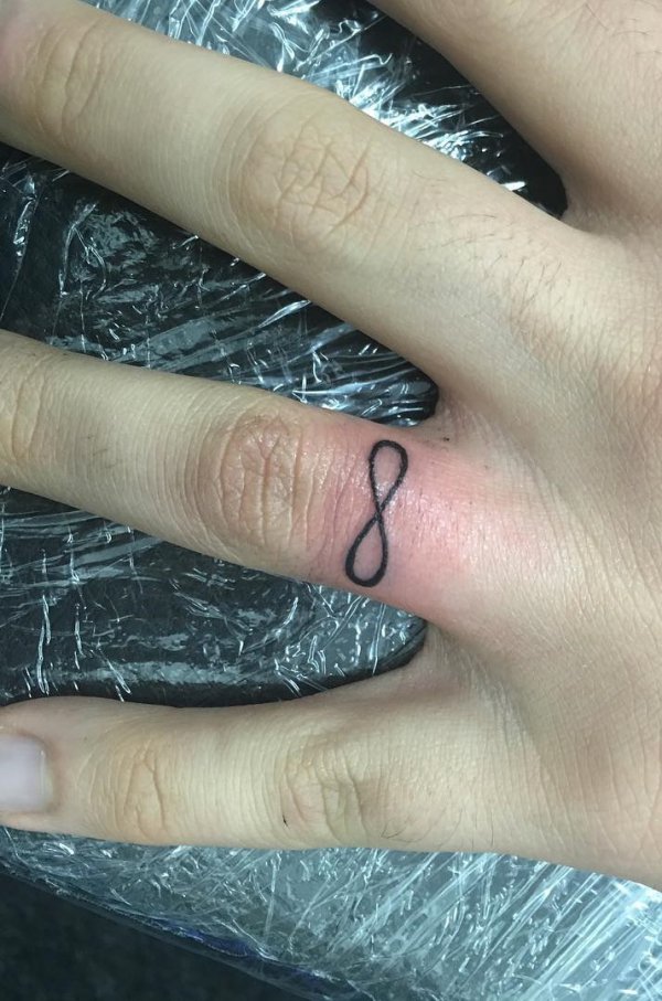 Infinity Symbol On His Ring Finger