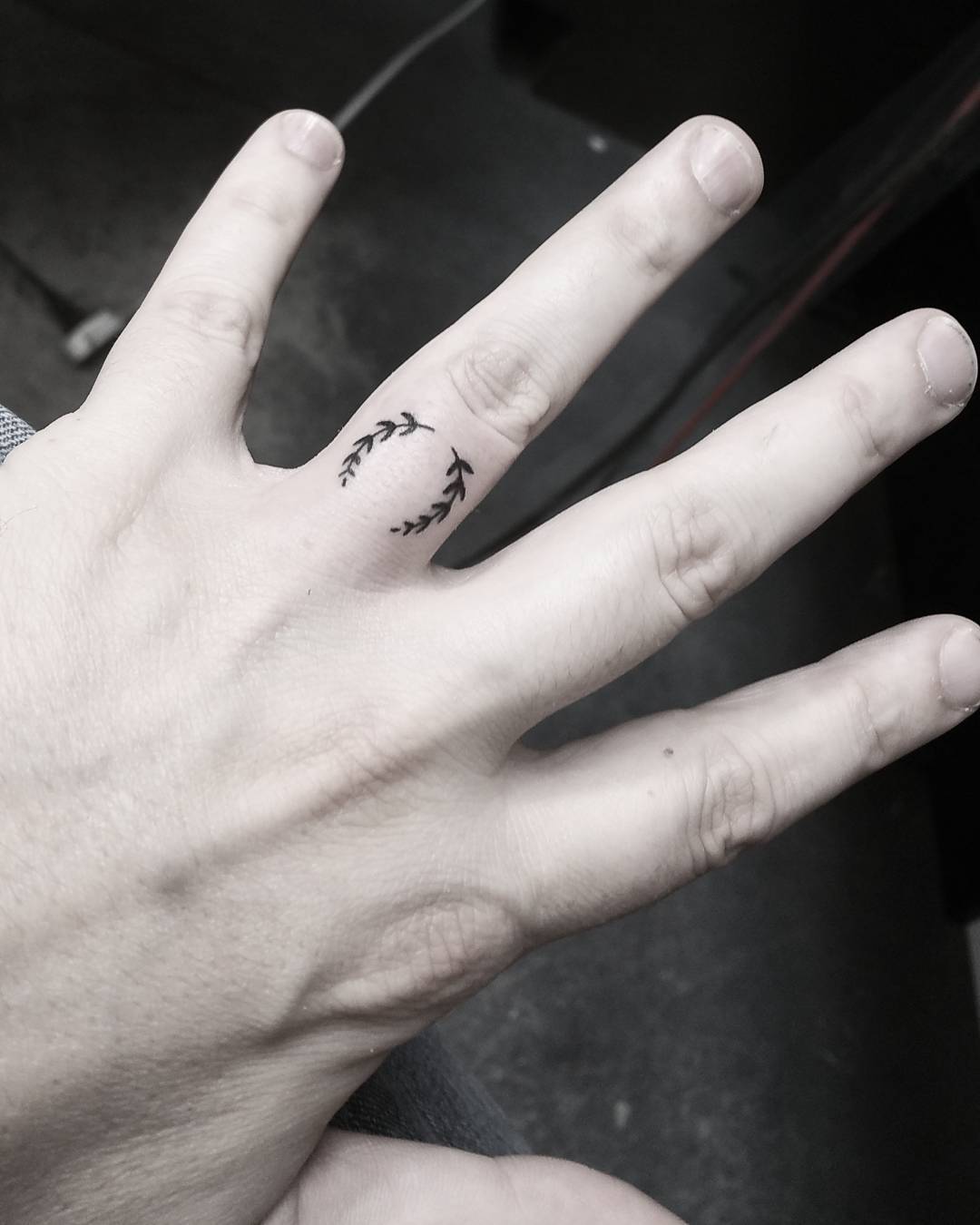Laurel Wreath Ring Finger Tattoo