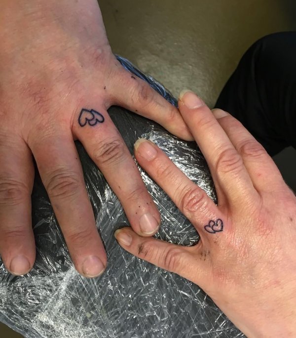 Marvelous Hearts Couple Ring Finger Tattoo