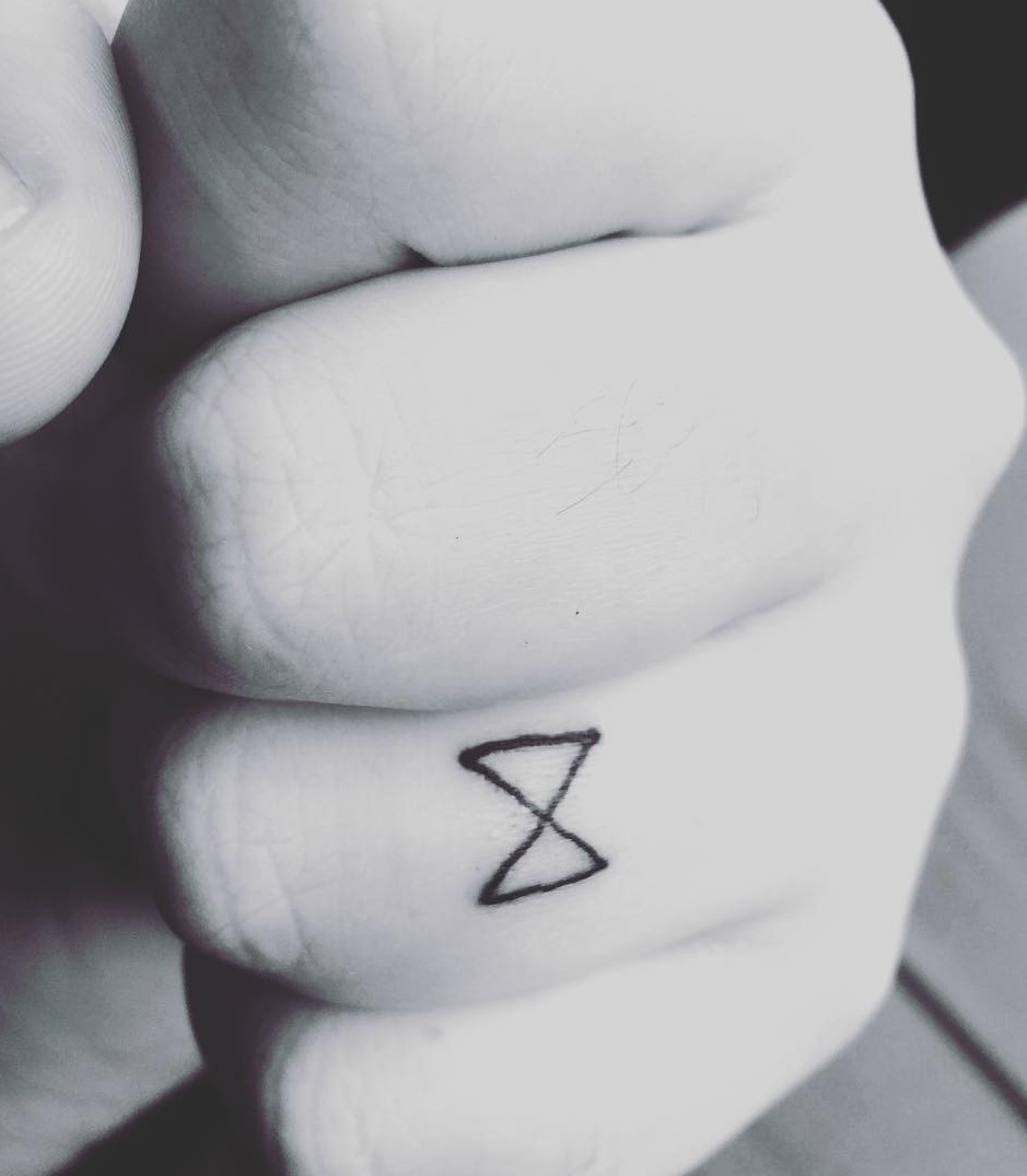 Meaningful Ring Finger Tattoo