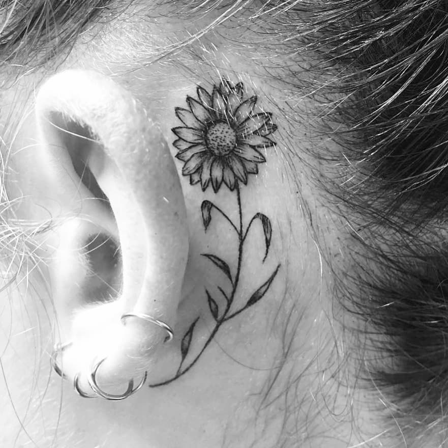 Rocking Sunflower Tattoo Behind The Ear