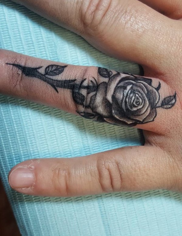 Rose Cover-Up On Ring Finger