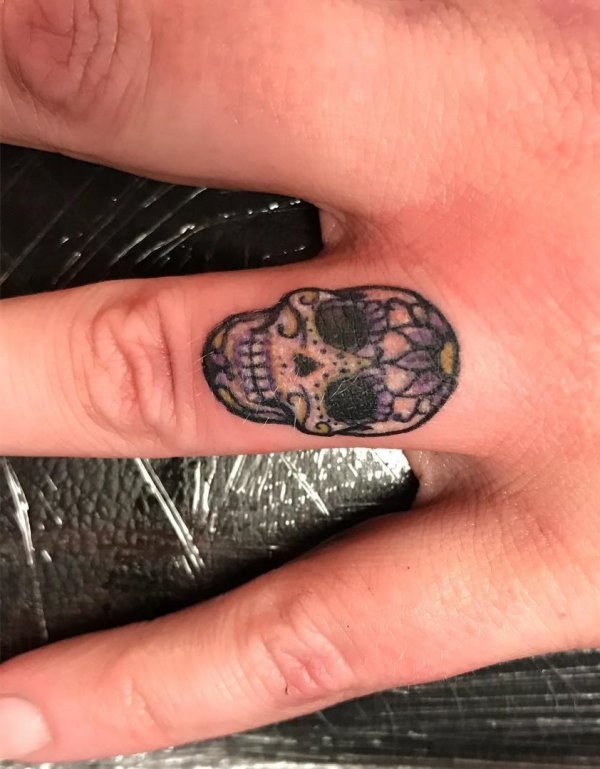 Sugar Skull Ring Finger Tattoo
