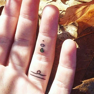Tiny Ring Finger Tattoo
