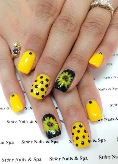 Yellow Nail Art Done With Polka Dots And Sunflower For Summer