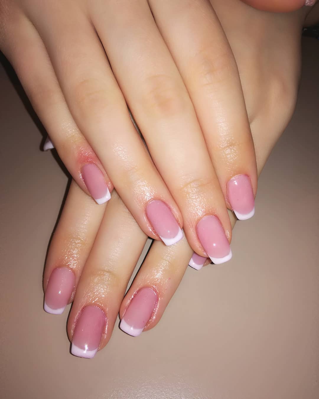 Chic Pink Nails With White French Tips Blurmark Decorate your tips with a thin layer of glitter polish between the light pink base color and the white tip. chic pink nails with white french tips