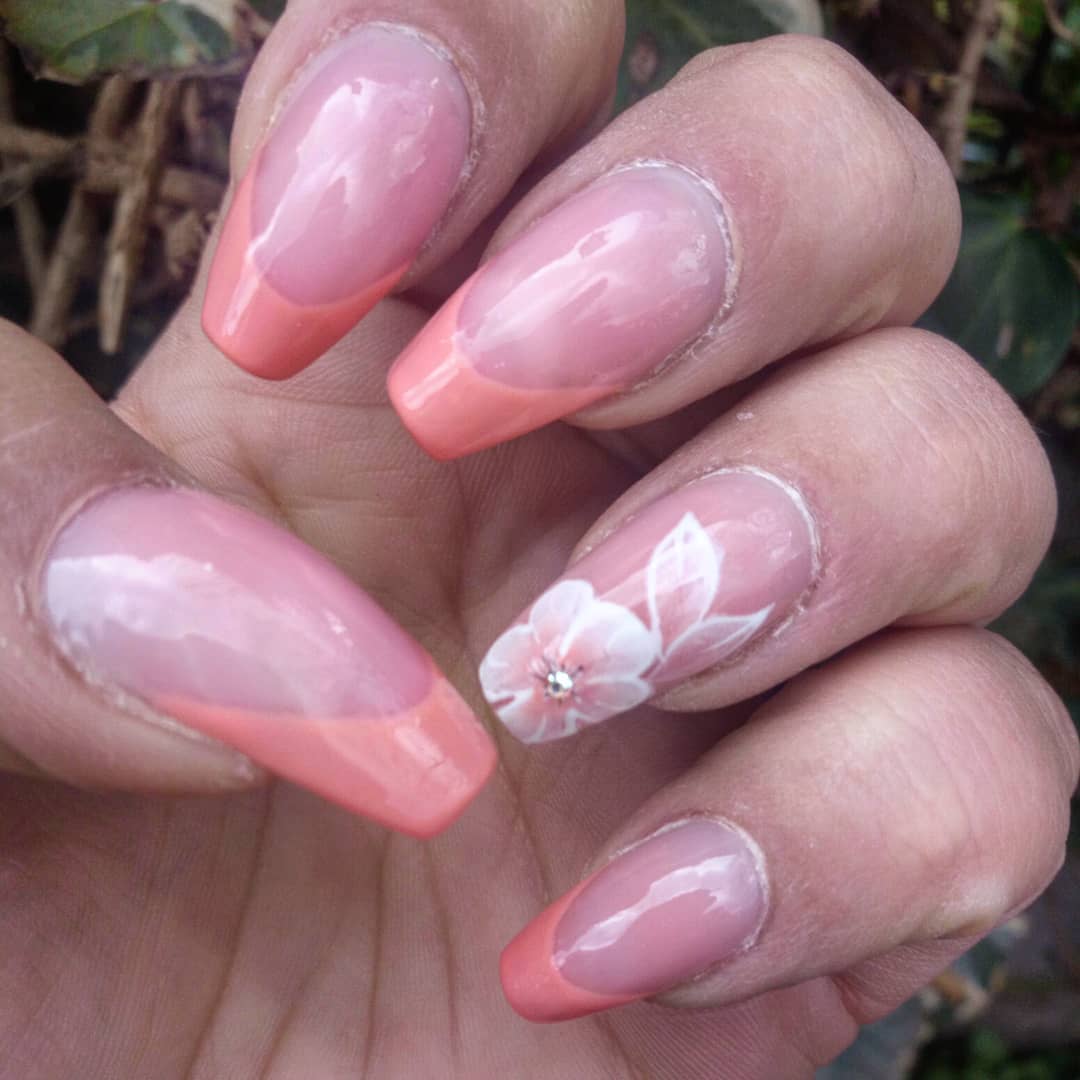 Flower Decor On Peach French Tips Nails