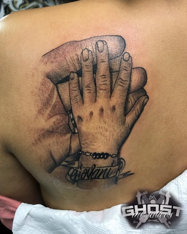 Realistic Holding Hand Tattoo On Back Shoulder - Blurmark