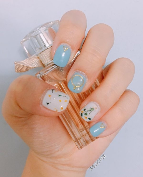 Accessorized And Decorated Light Blue And White Floral Nails