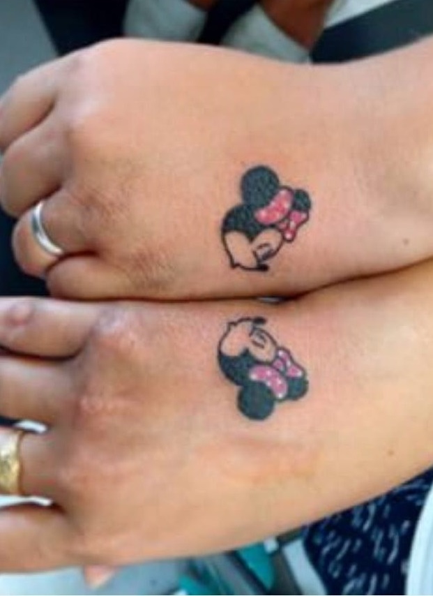 Adorable Mickey And Minnie Mouse Tattoo On Hand