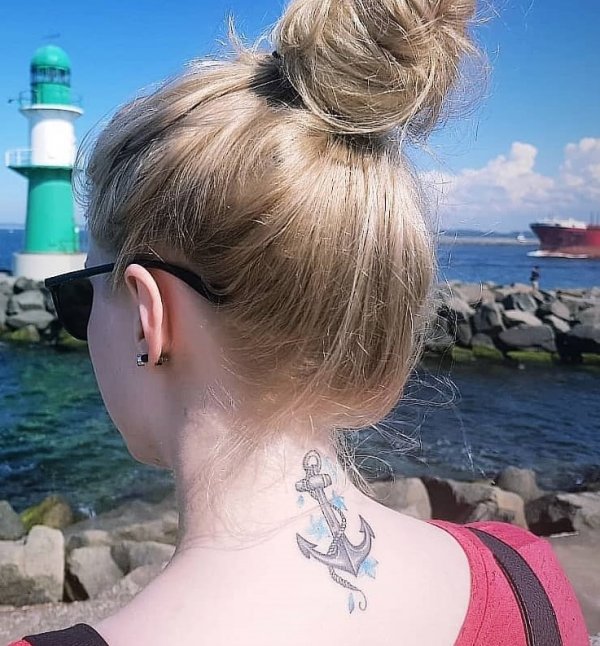 Amazing black ink anchor tattoo design on the neck
