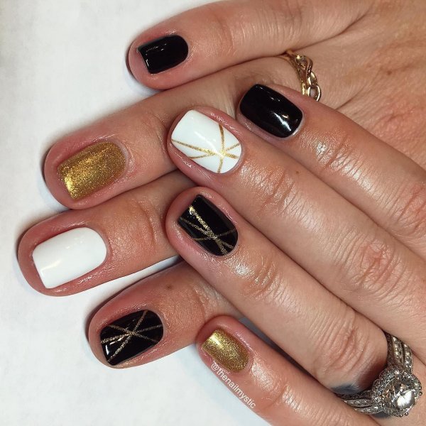 Black and white with golden stripes geometric nails