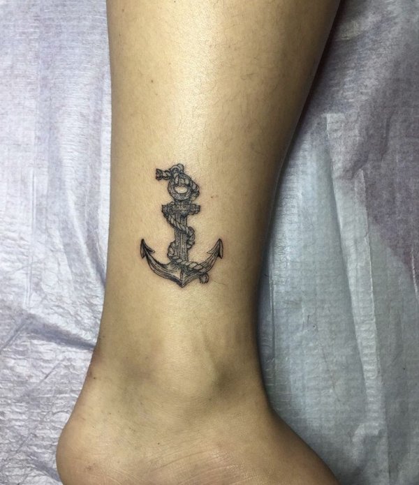 Charismatic anchor tattoo on lower leg