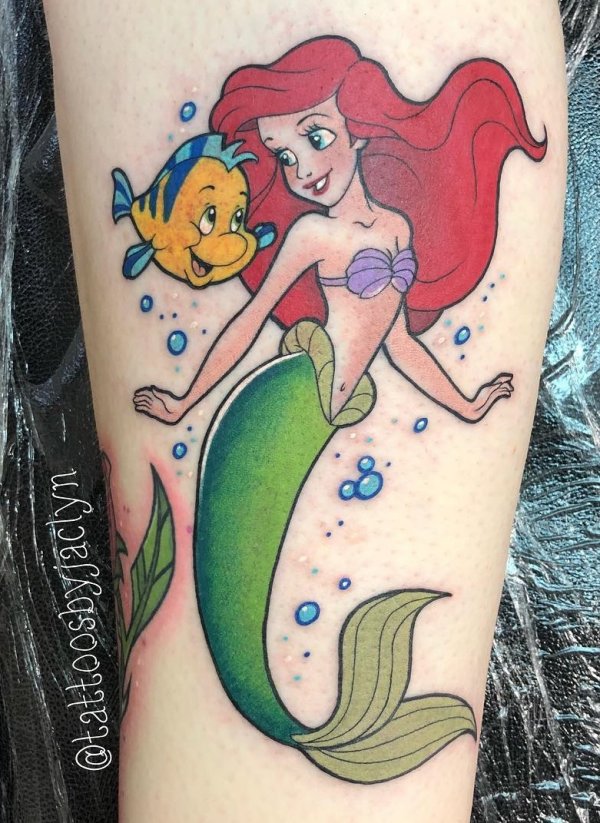 Chilling Mermaid In Style Tattoo