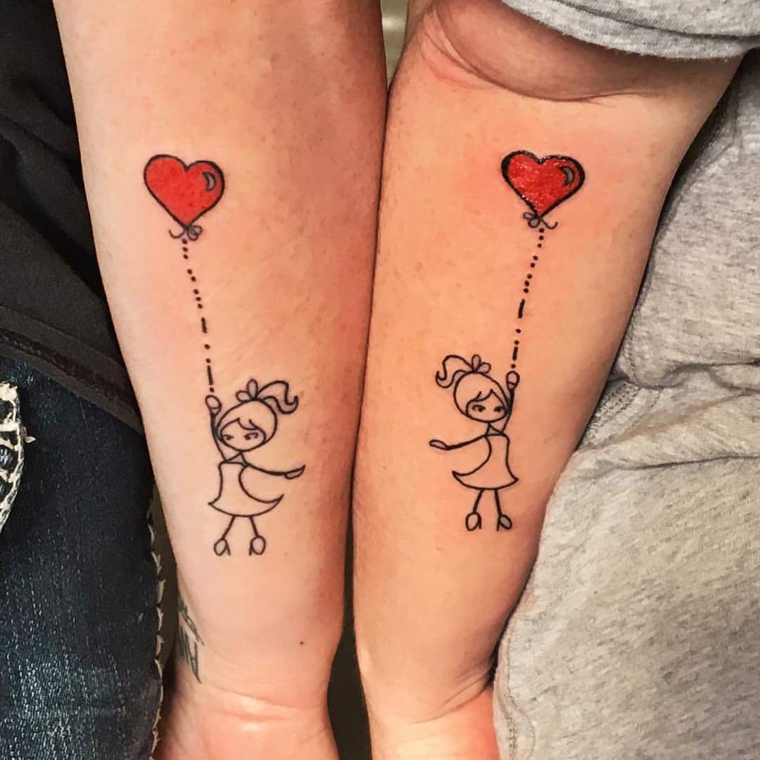 Cool Dancing Sisters With Red Heart Balloon Tattoo On Arms