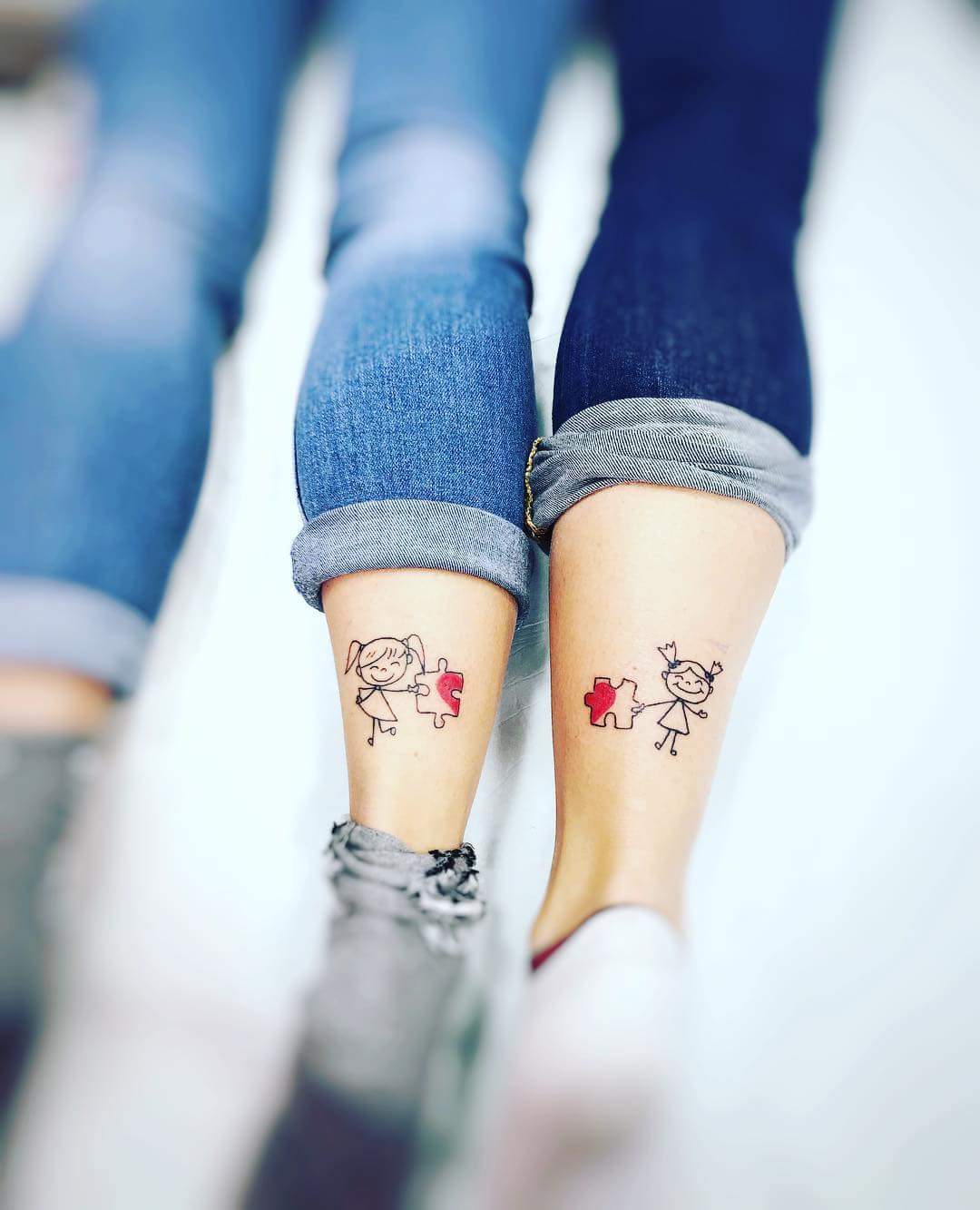 Dashing Sister Symbol Lower Legs Tattoo