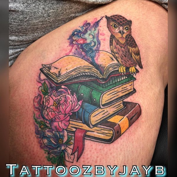Dazzling Tattoo Owl on A Stack Of Books With Flowers