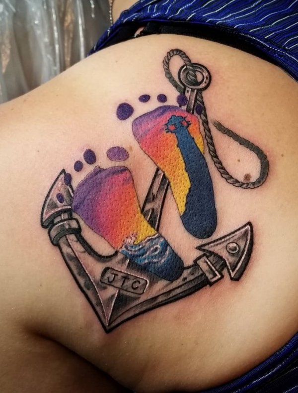 Exclusive colorful anchor tattoo with sunset, light house, ocean and footprint