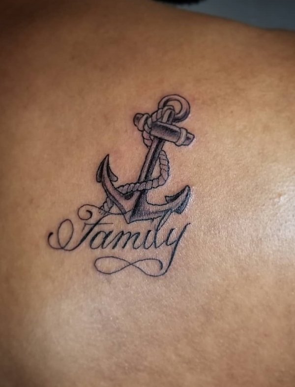 Fabulous black and grey anchor family tattoo on back