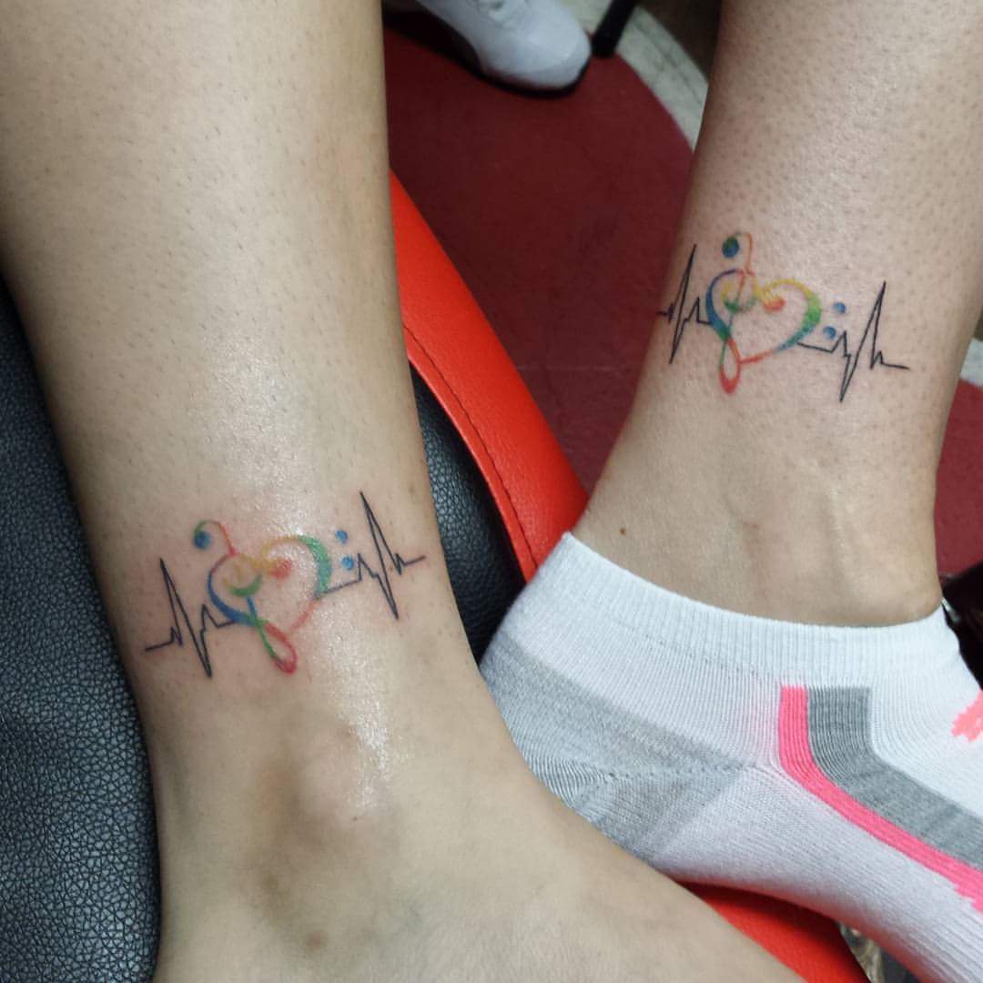 Heart And Lifeline Color Matching Sister Tattoo On Ankle