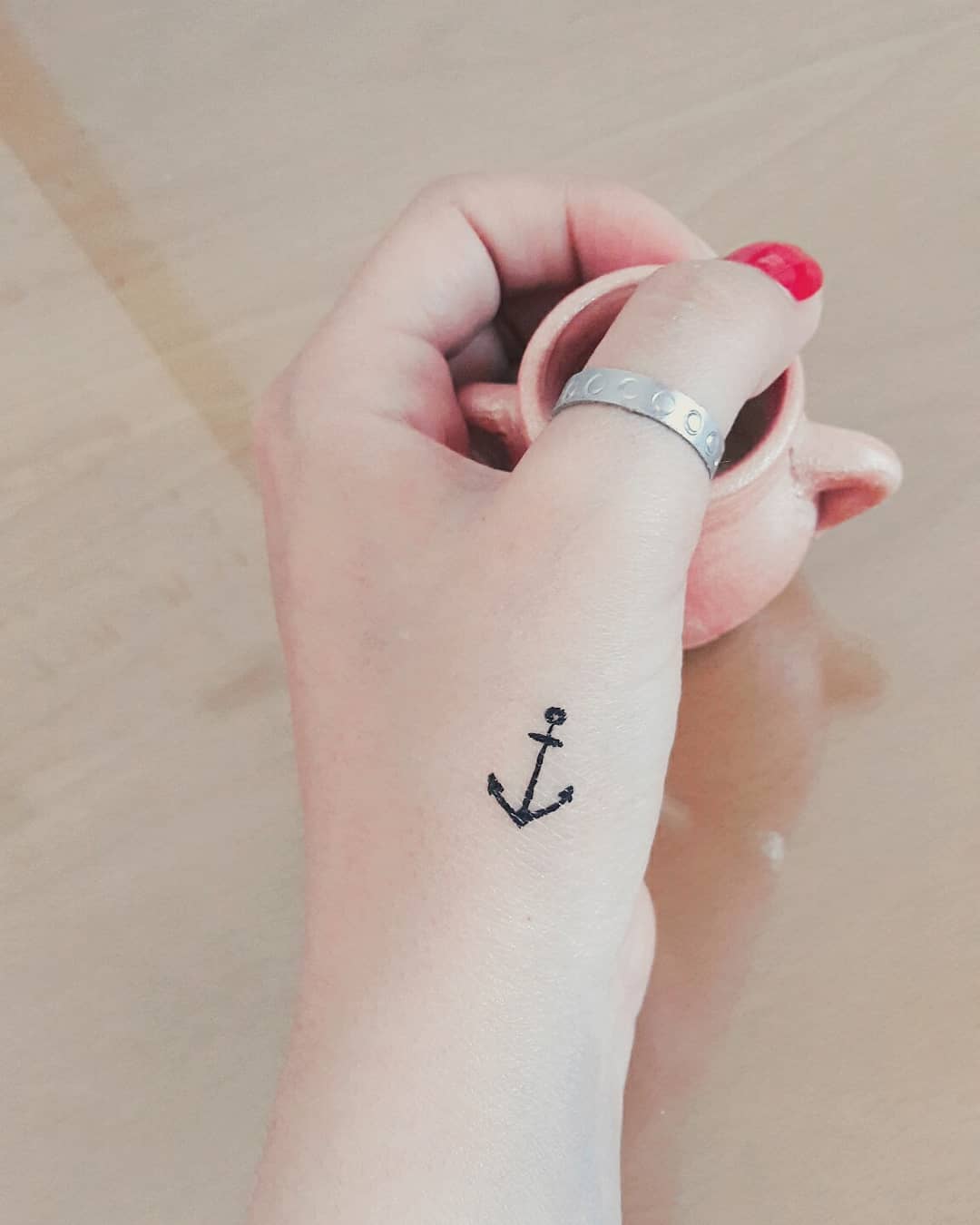 Little anchor tattoo on hand
