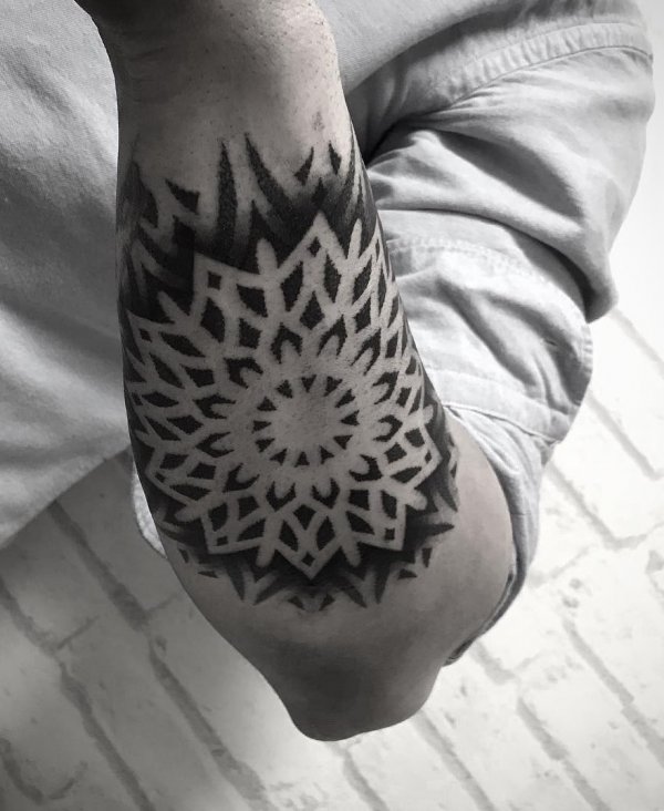 Mandala Negative Space Tattoo On Lower Arm