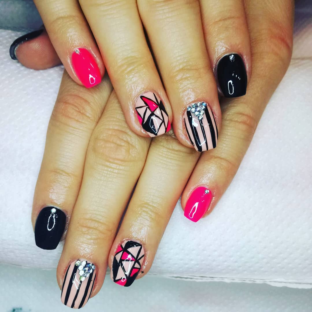 Stylish pink and black geometric nails