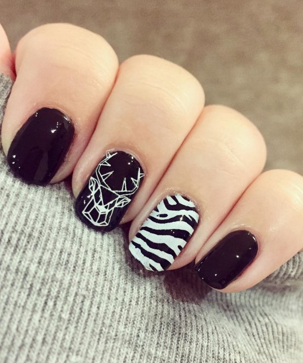 Wildlife inspired black geometric nails