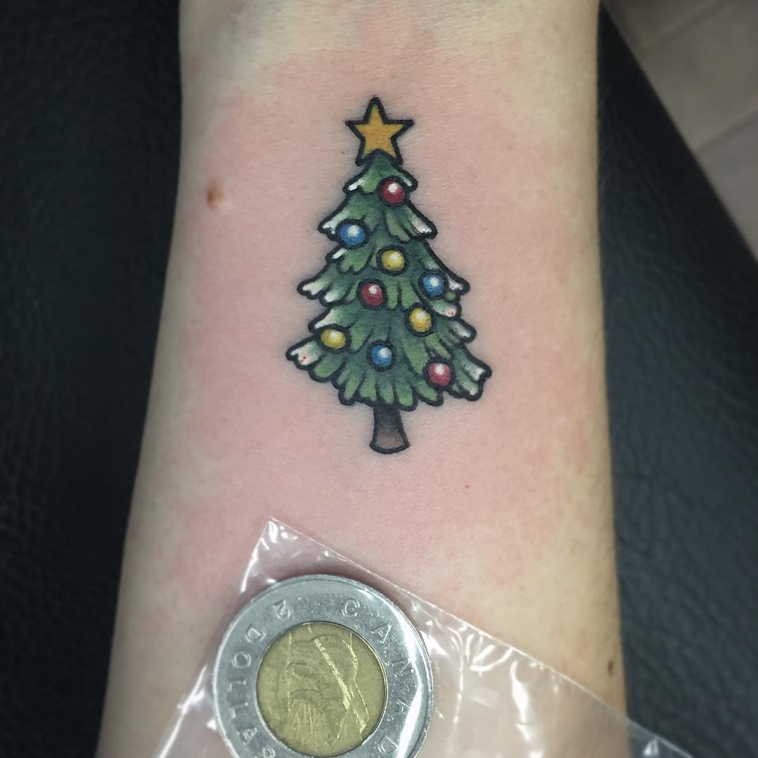 Absolutely chic Christmas tree tattoo.