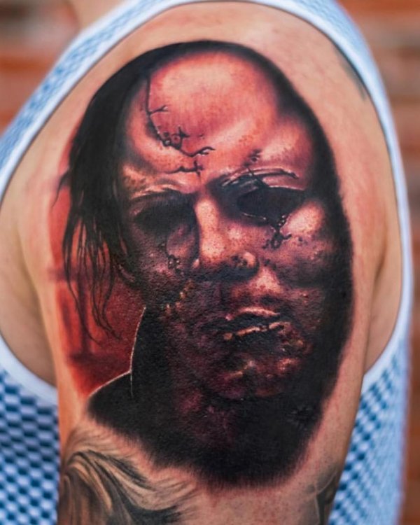 Absolutely haunted killer tattoo on half sleeve. Pic by tradesmantattoo