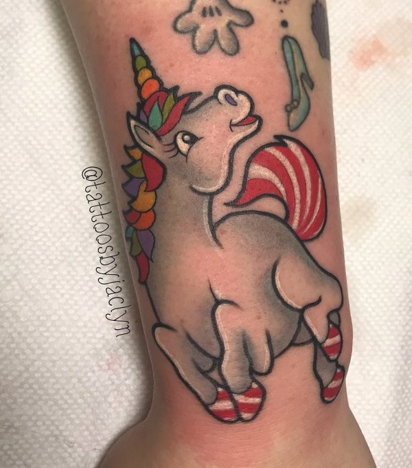 Charismatic unicorn tattoo on hand