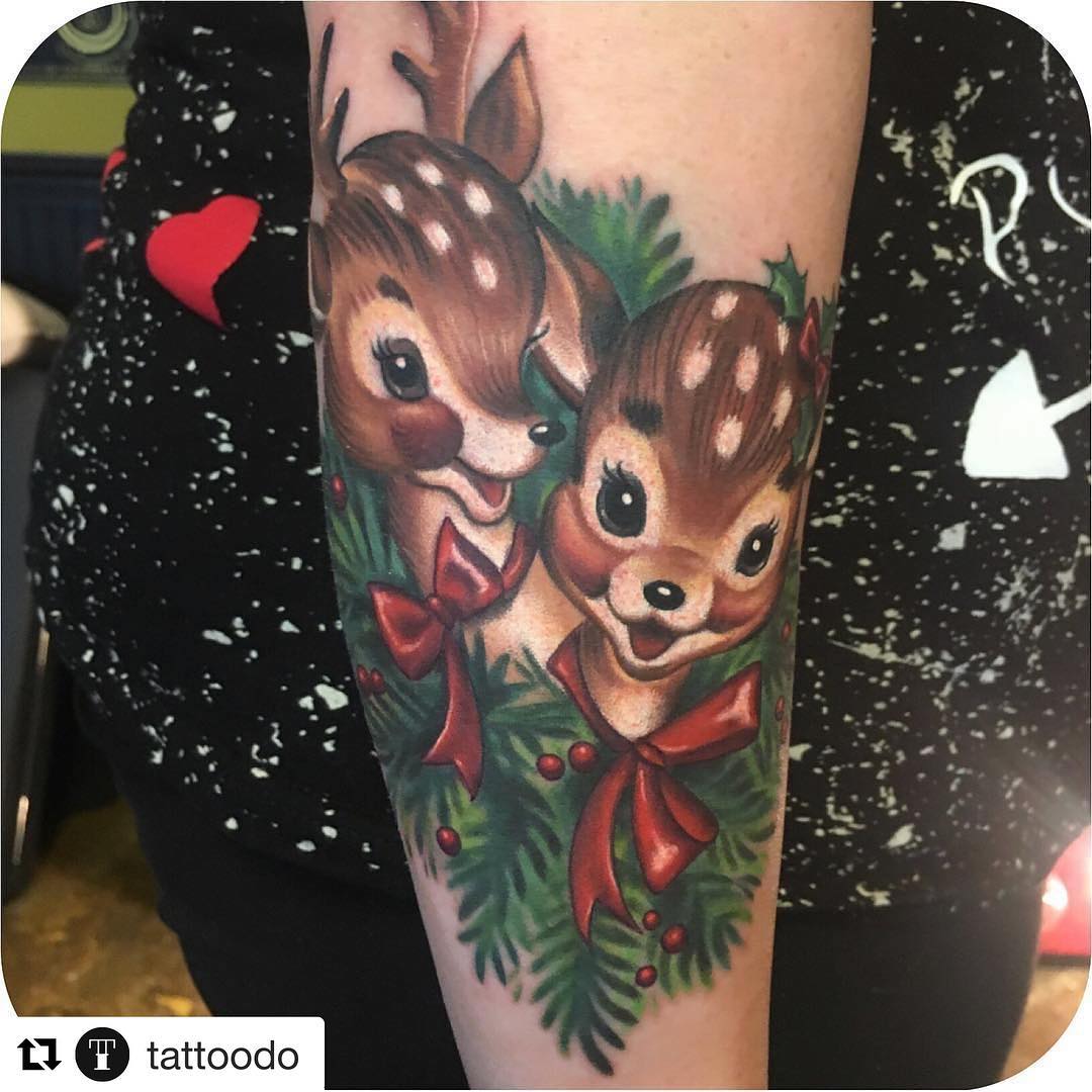 Chic couple reindeer tattoo.
