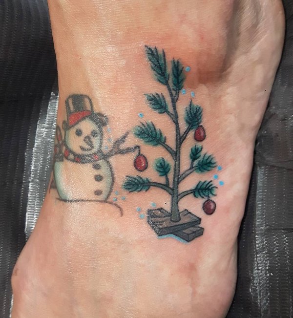 Decorated tree with snowman foot tattoo design