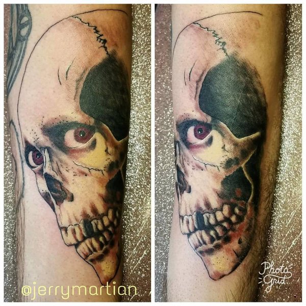 Evil skull tattoo on sleeve. Pic by martianartstattoo